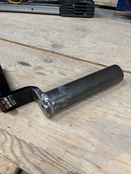 Antenna mast holder: round steel tube welded to a flat steel arm