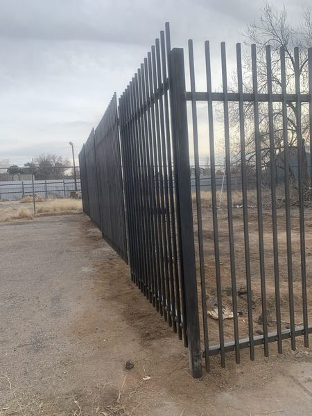 Black steel picket fence corner