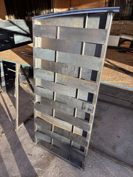 Woven gate panel in progress in the shop