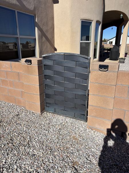 After: woven steel pedestrian gate fitted in the block wall opening
